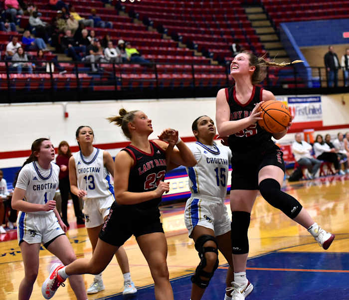 Owasso's Makenna Yokley (with ball) goes up for a basket during the title game of the John Nobles Invitational on Jan. 20, 2024, in Moore.